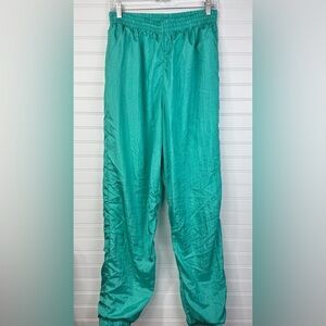 Vintage 90’s women’s teal lined windbreaker jogging pants. Size XL.
